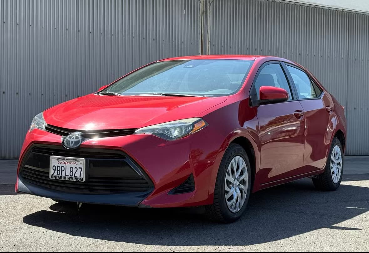 Red Toyota Corolla rental car