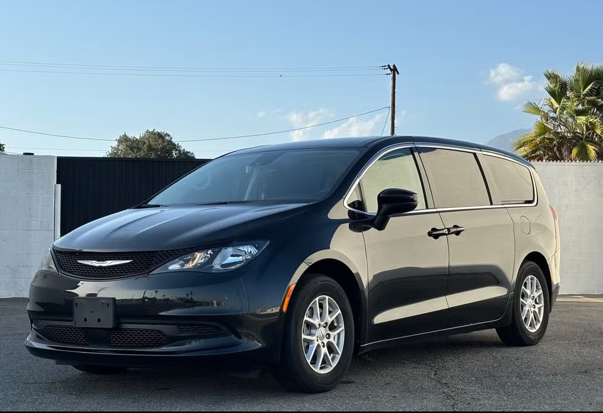 Black Chrysler Voyager rental car