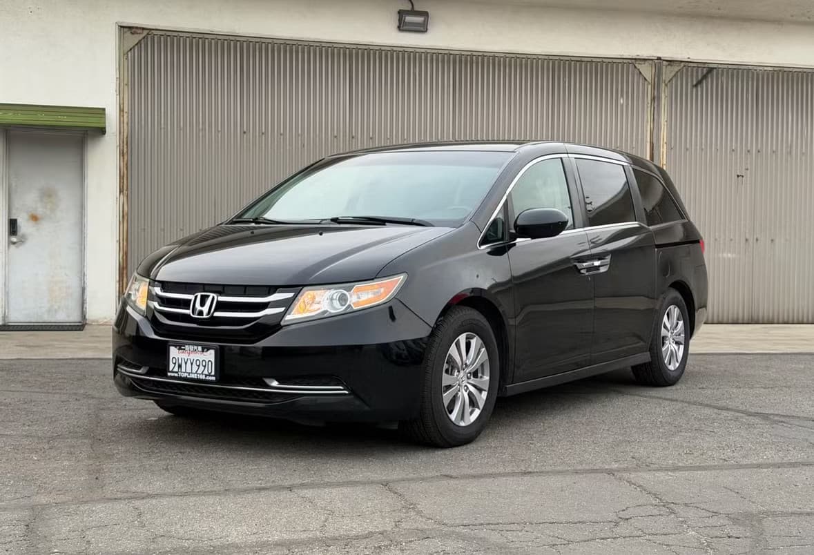 Black Honda Odyssey rental car